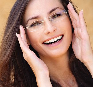 Young lady wearing eyeglasses smiling