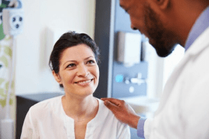 A lady talking to a doctor